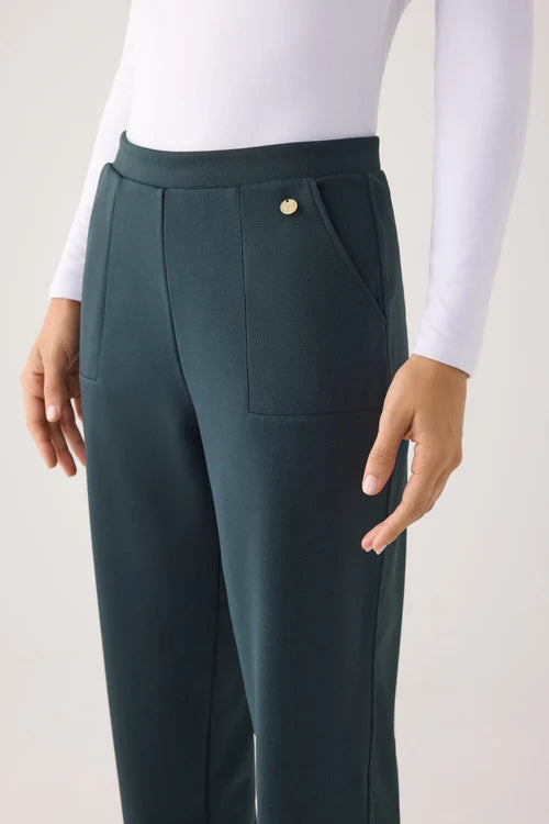 Pantalones slim textura piqué tiro alto verde botella