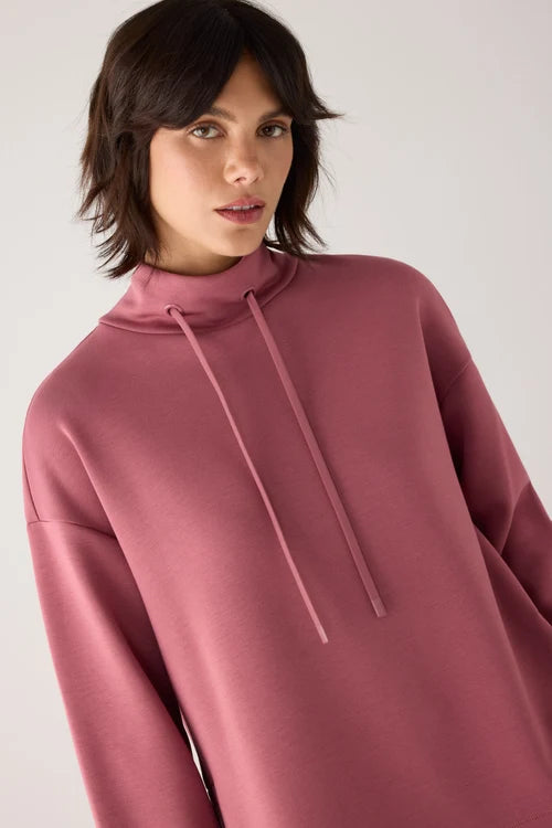 Jersey afelpado cuello alto con cordones rosa